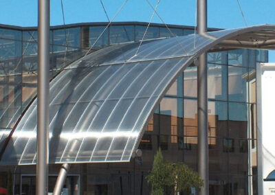 Large curved entrance canopy on steel structure