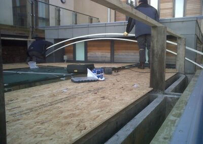 Sun Modul second curved steel glazing channel being installed