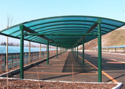 Curved canopy over parking bays